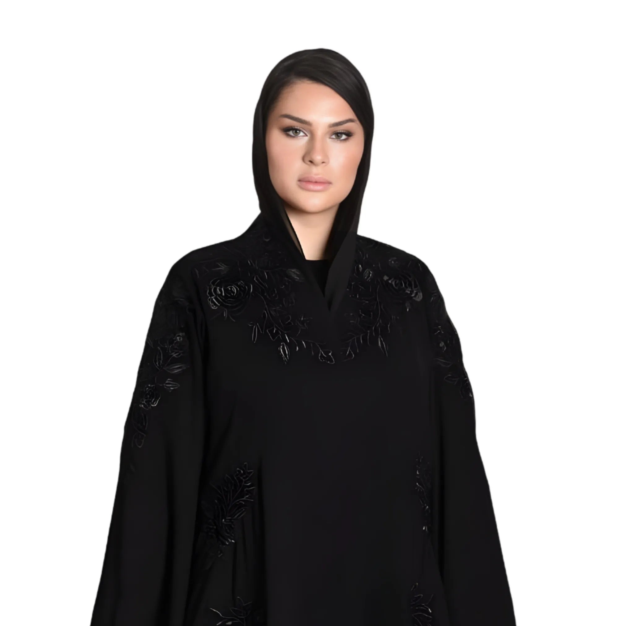 Woman wearing a black abaya with floral embroidery on a white background