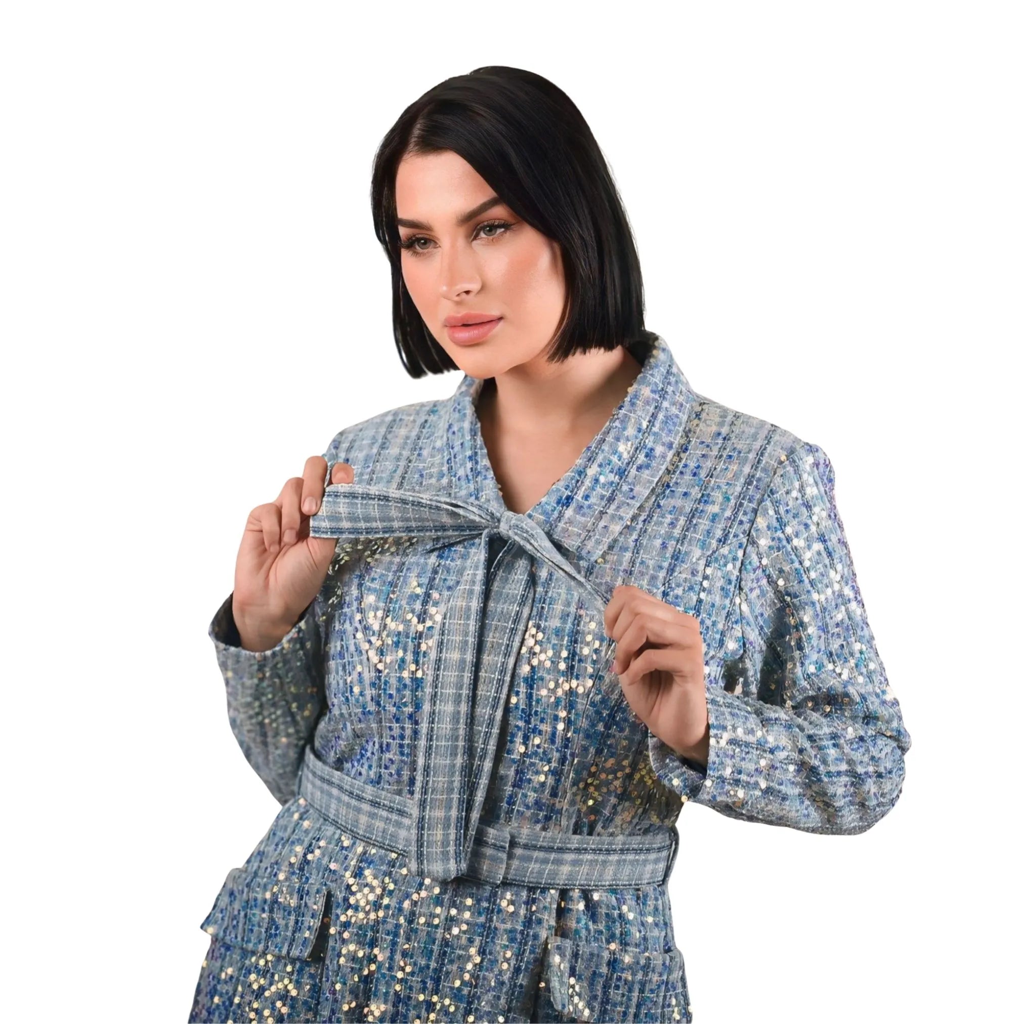 Woman wearing a blue sequin jacket on a white background