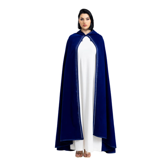 Person wearing a blue cape over a white jalabiya on a white background