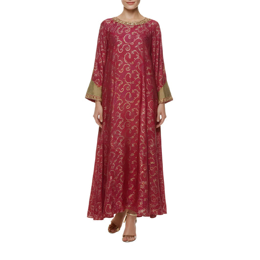 Red patterned dress with gold accents on a white background