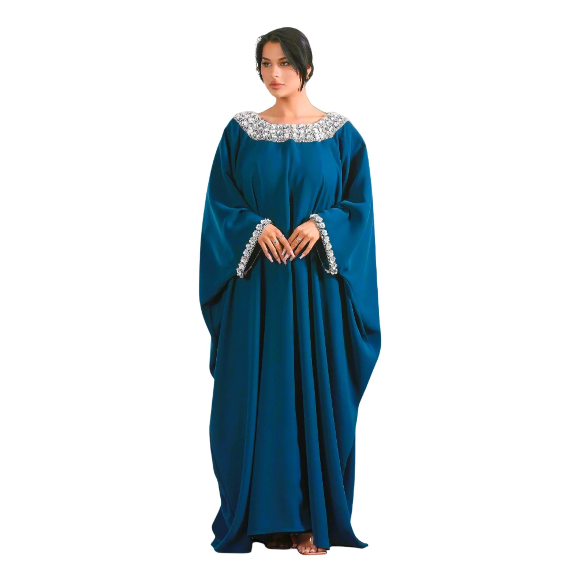 Woman wearing a blue Jalabiya with decorative neckline on a white background
