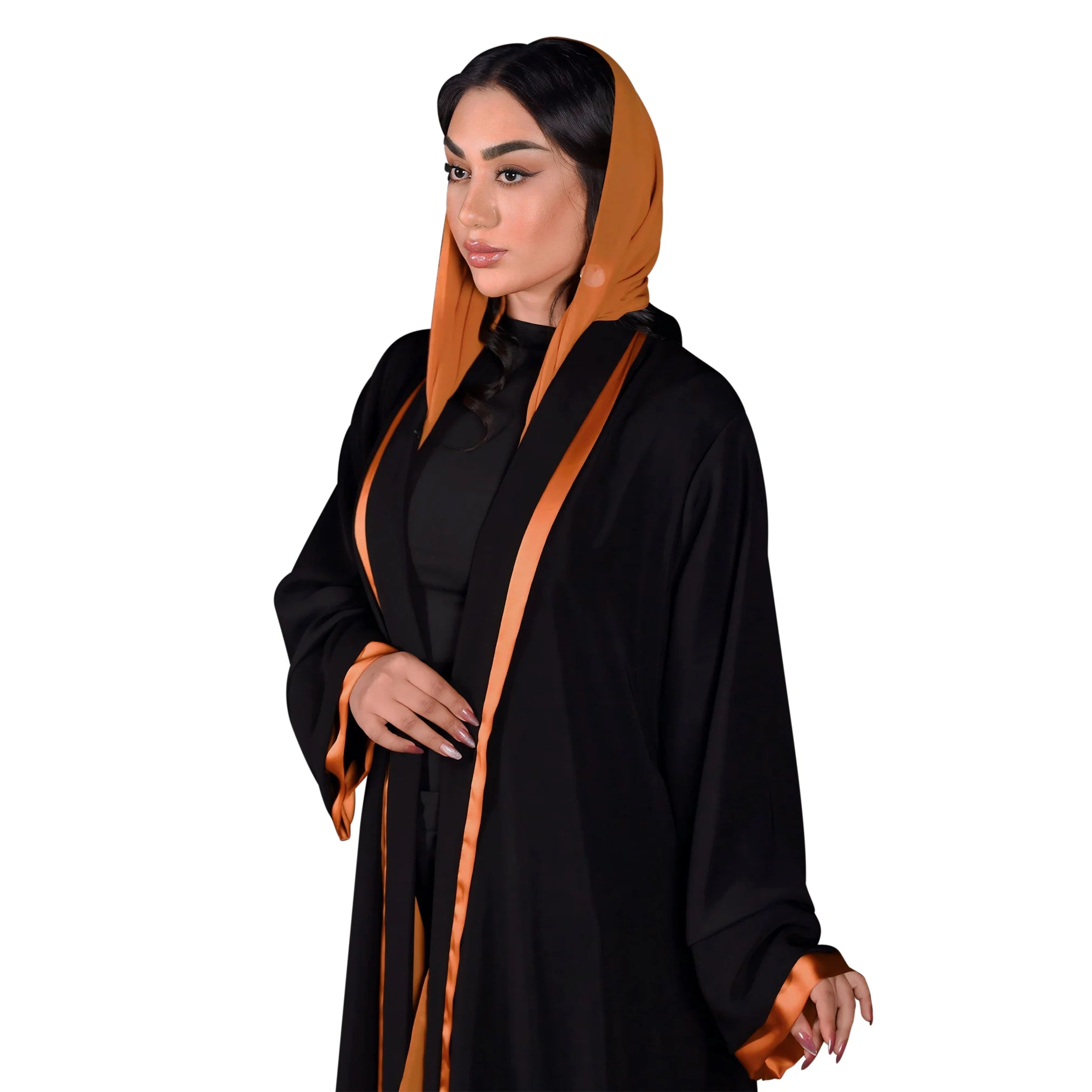 Woman wearing a black abaya with orange trim on a white background