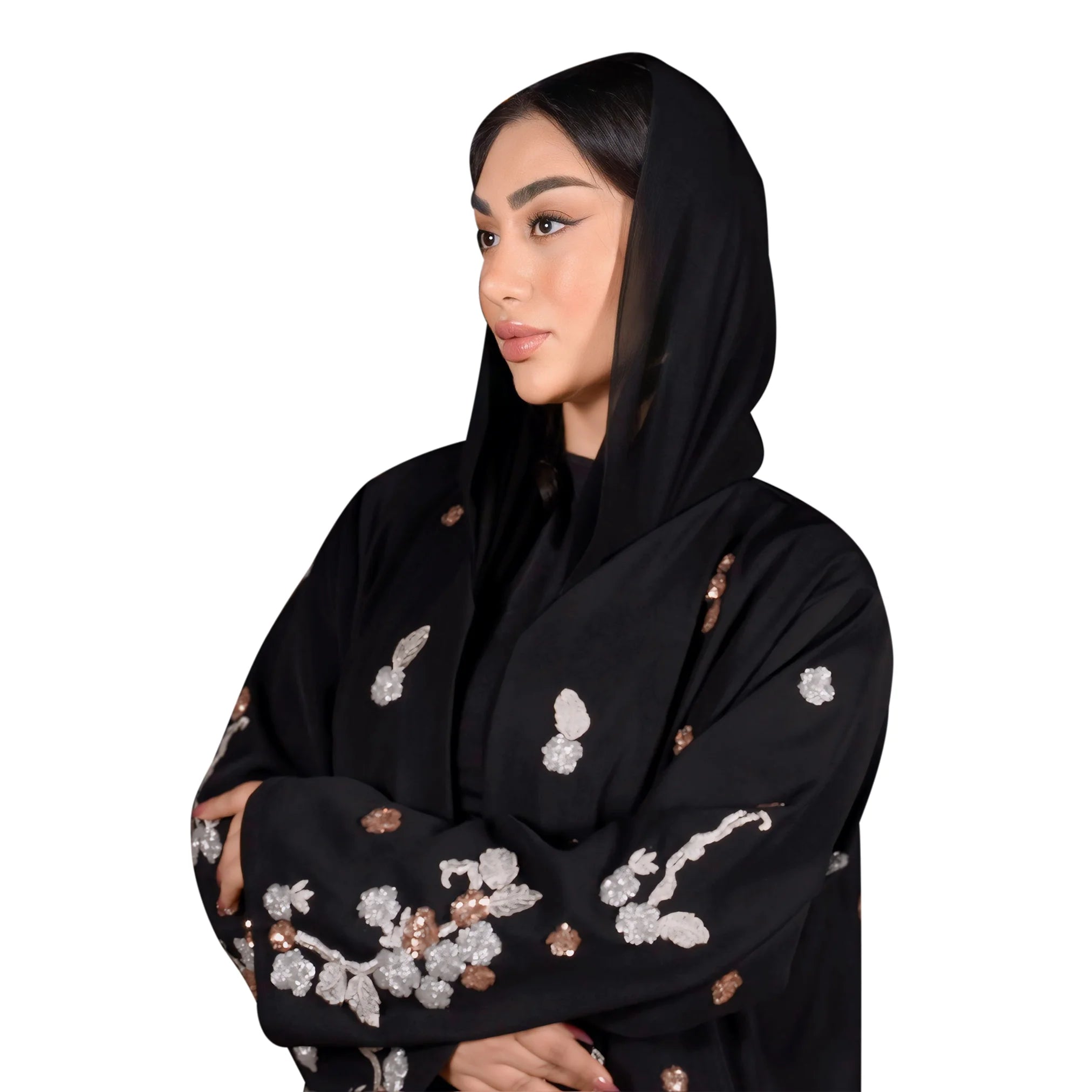 Woman wearing a black abaya with floral embroidery on a white background