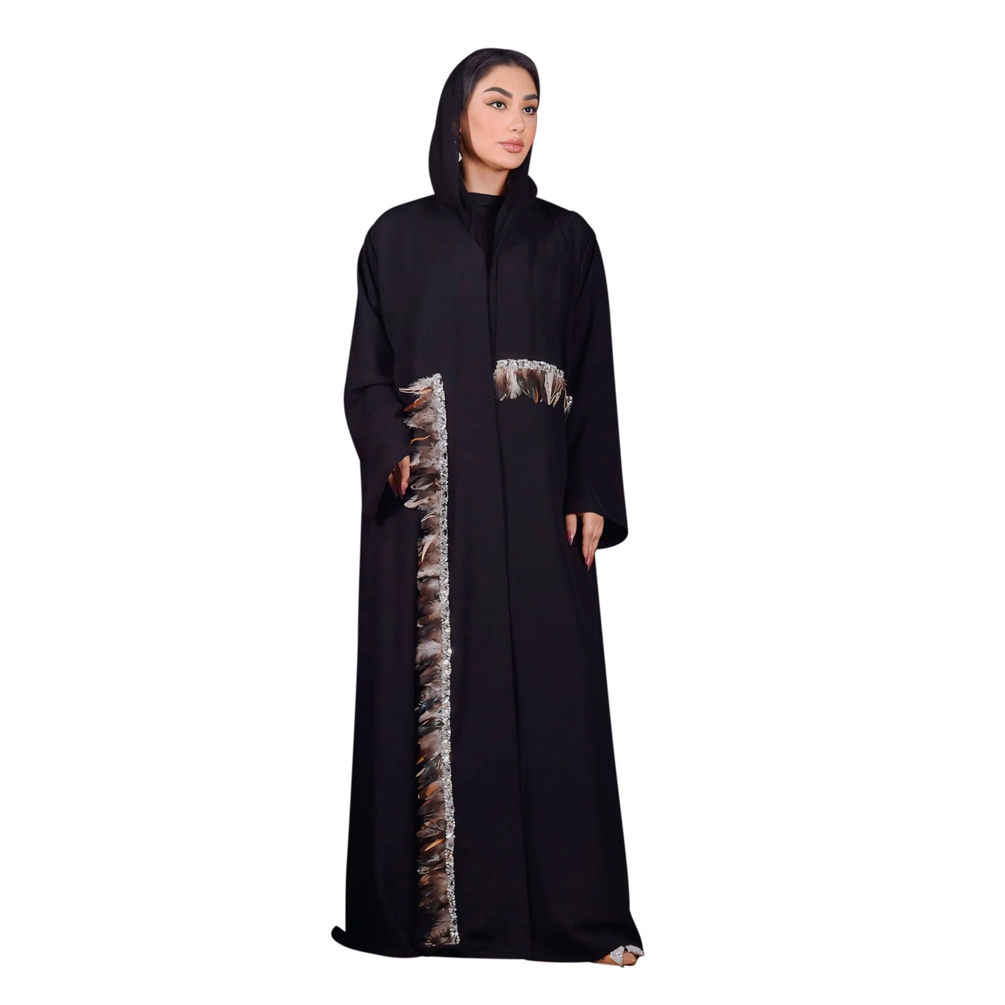 Woman wearing a black abaya with decorative side panels on a white background