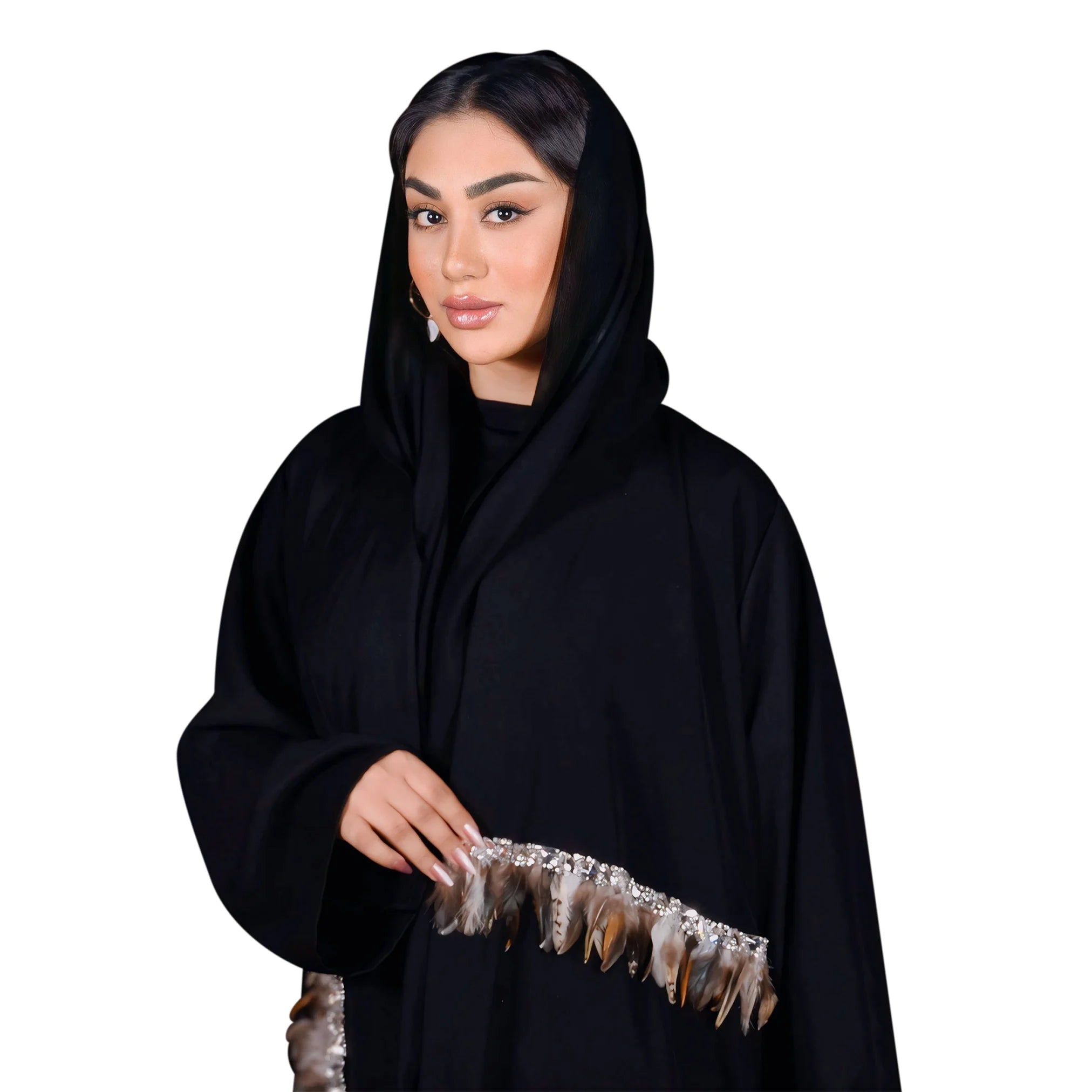 Woman wearing a black abaya with feather details on a white background