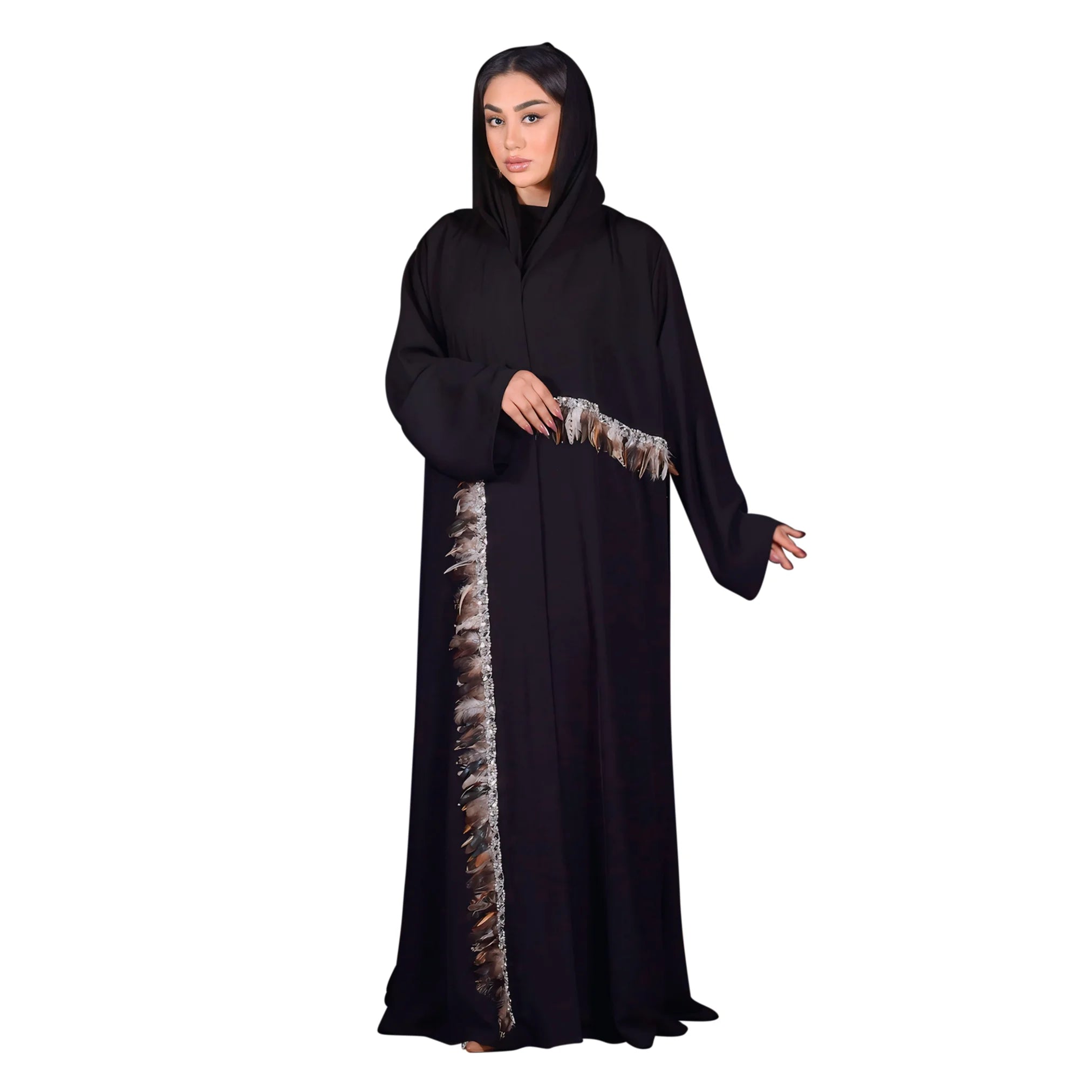 Woman wearing a black abaya with a decorative side panel on a white background