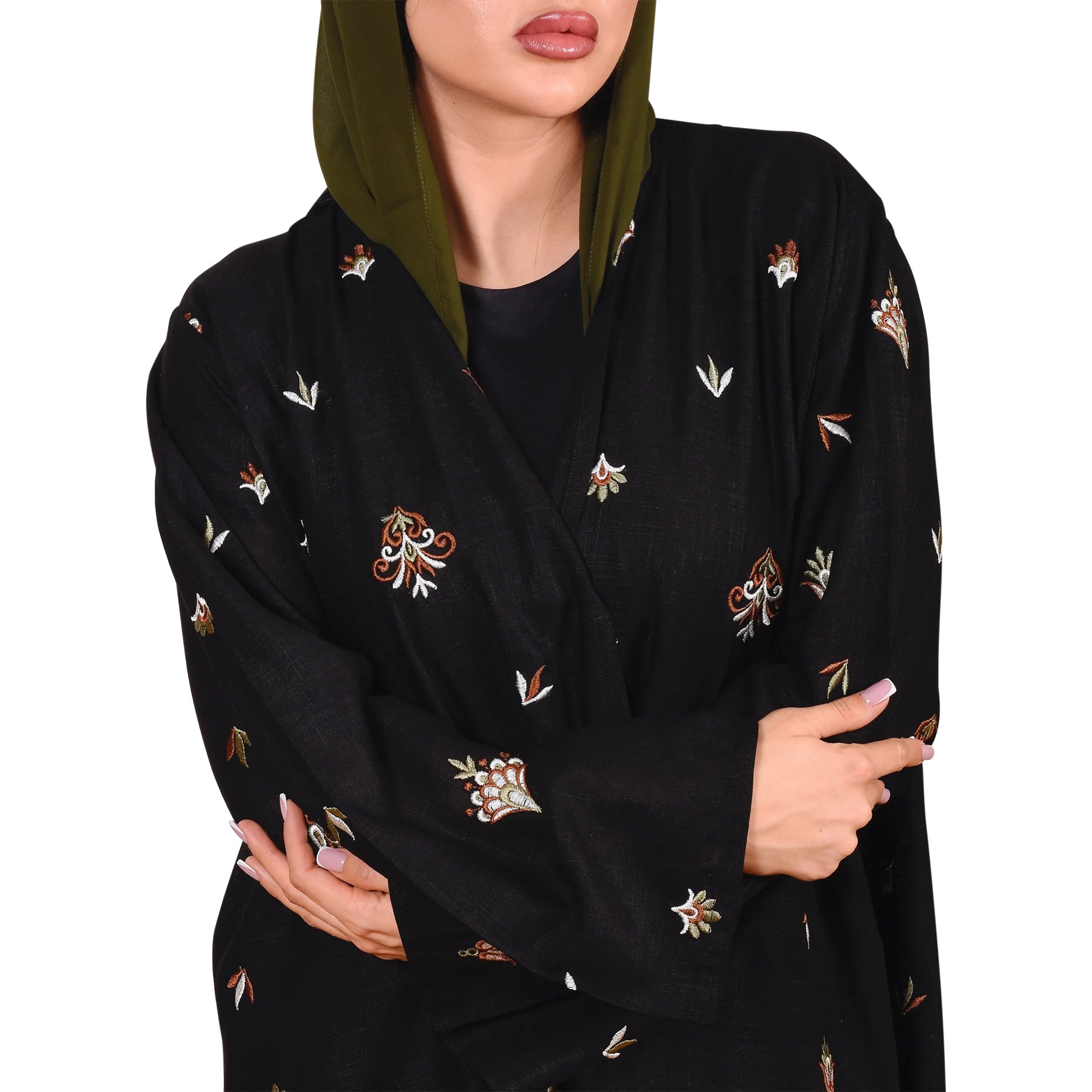 Woman wearing a black abaya and scarf with floral patterns on a white background