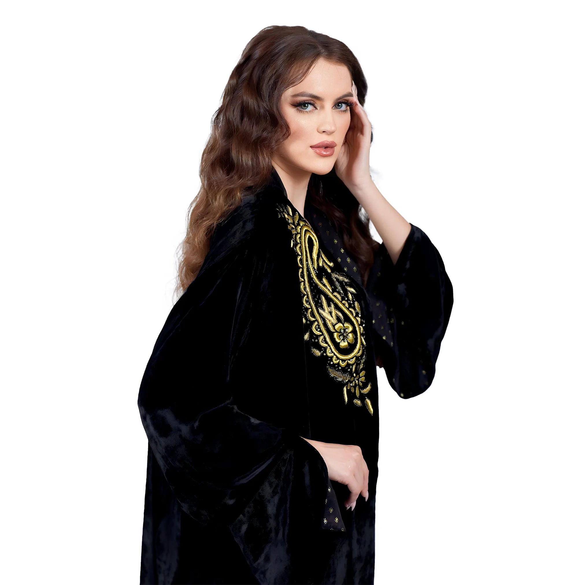 Woman wearing a black robe with gold embroidery on a white background