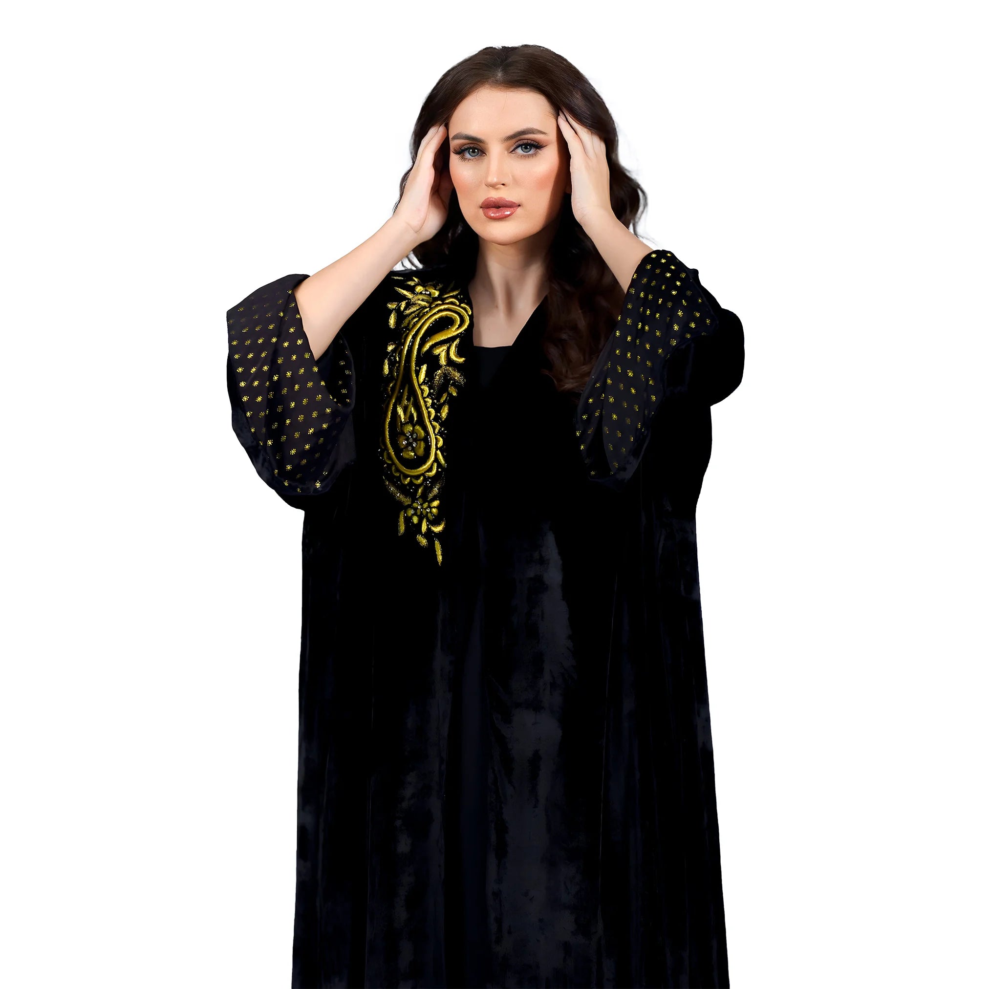 Woman wearing a black dress with gold embroidery on a white background
