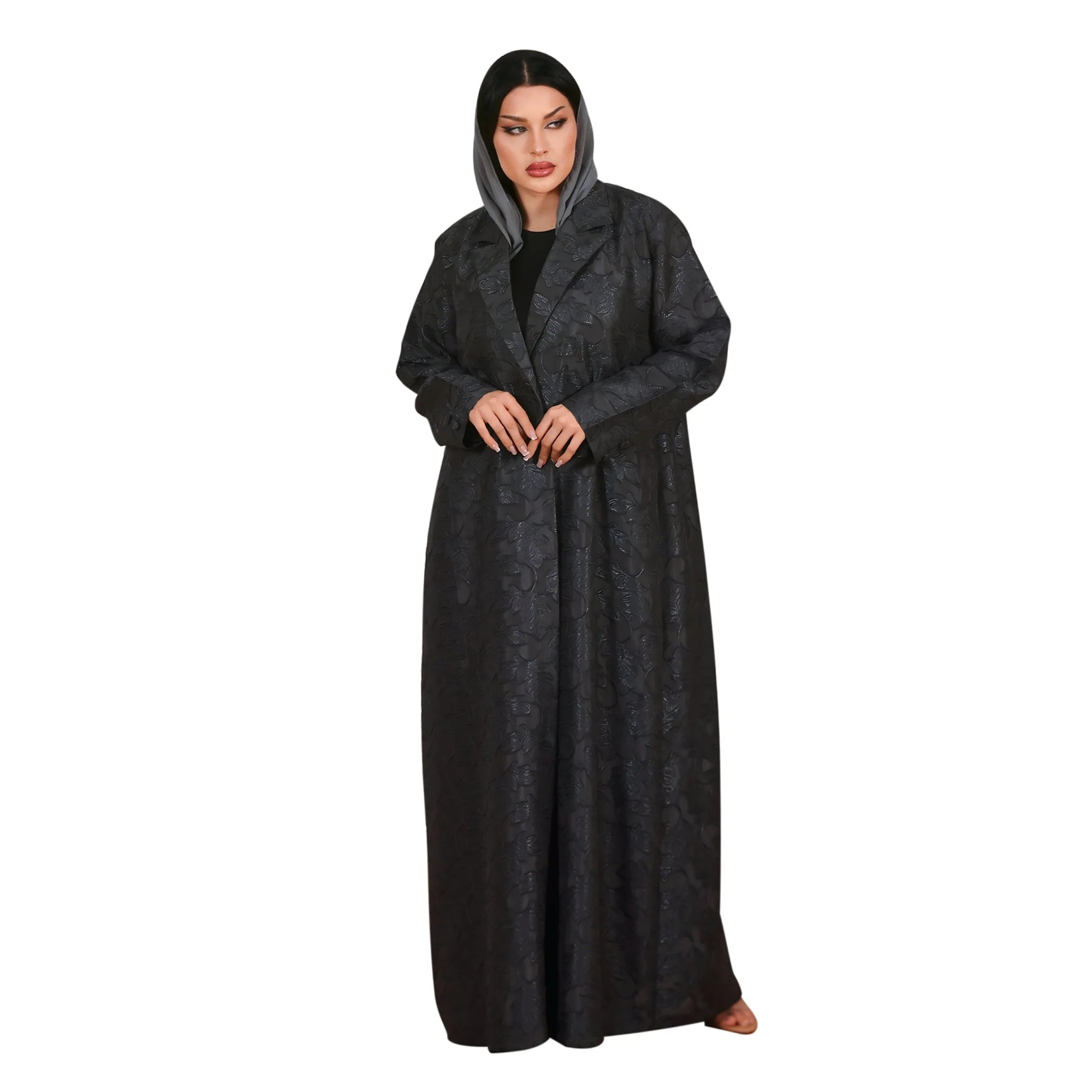 Person wearing a long dark gray robe on a white background