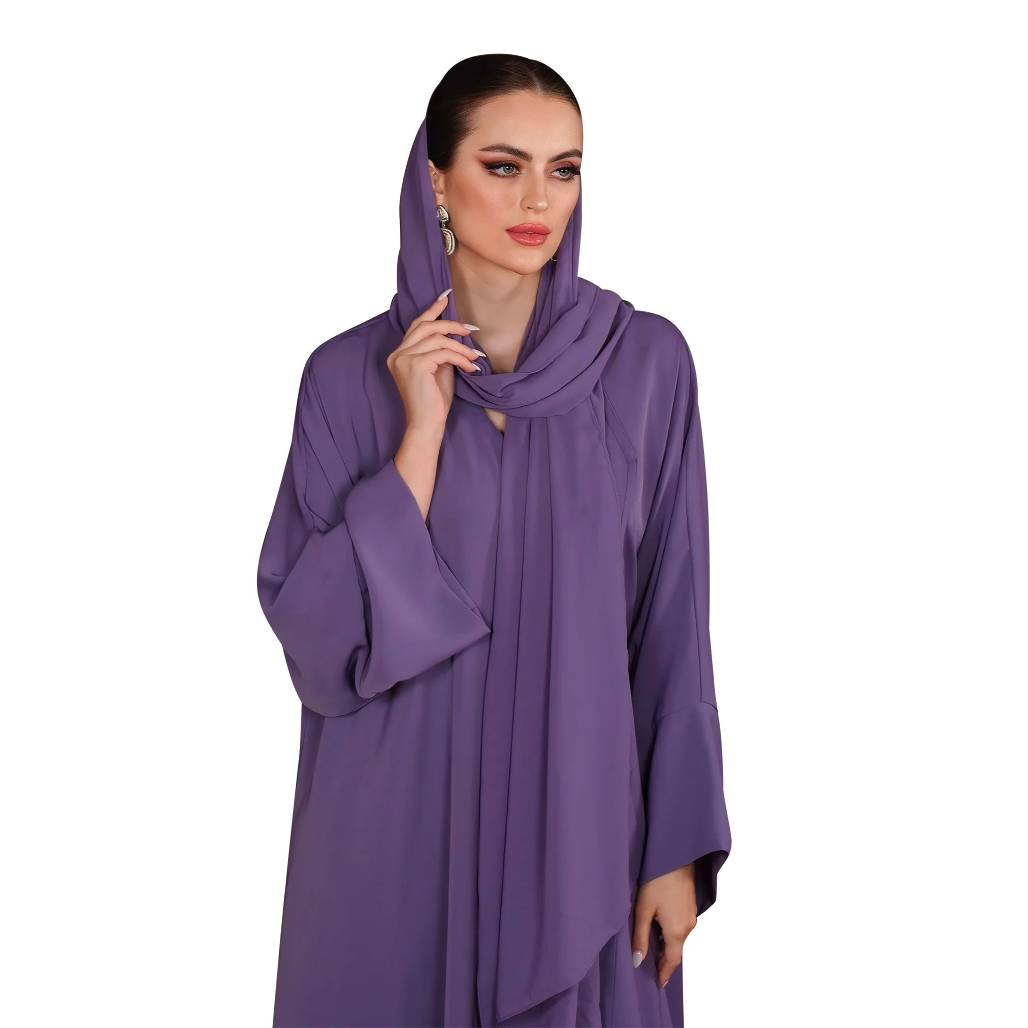 Woman wearing a purple dress with a matching headscarf on a white background