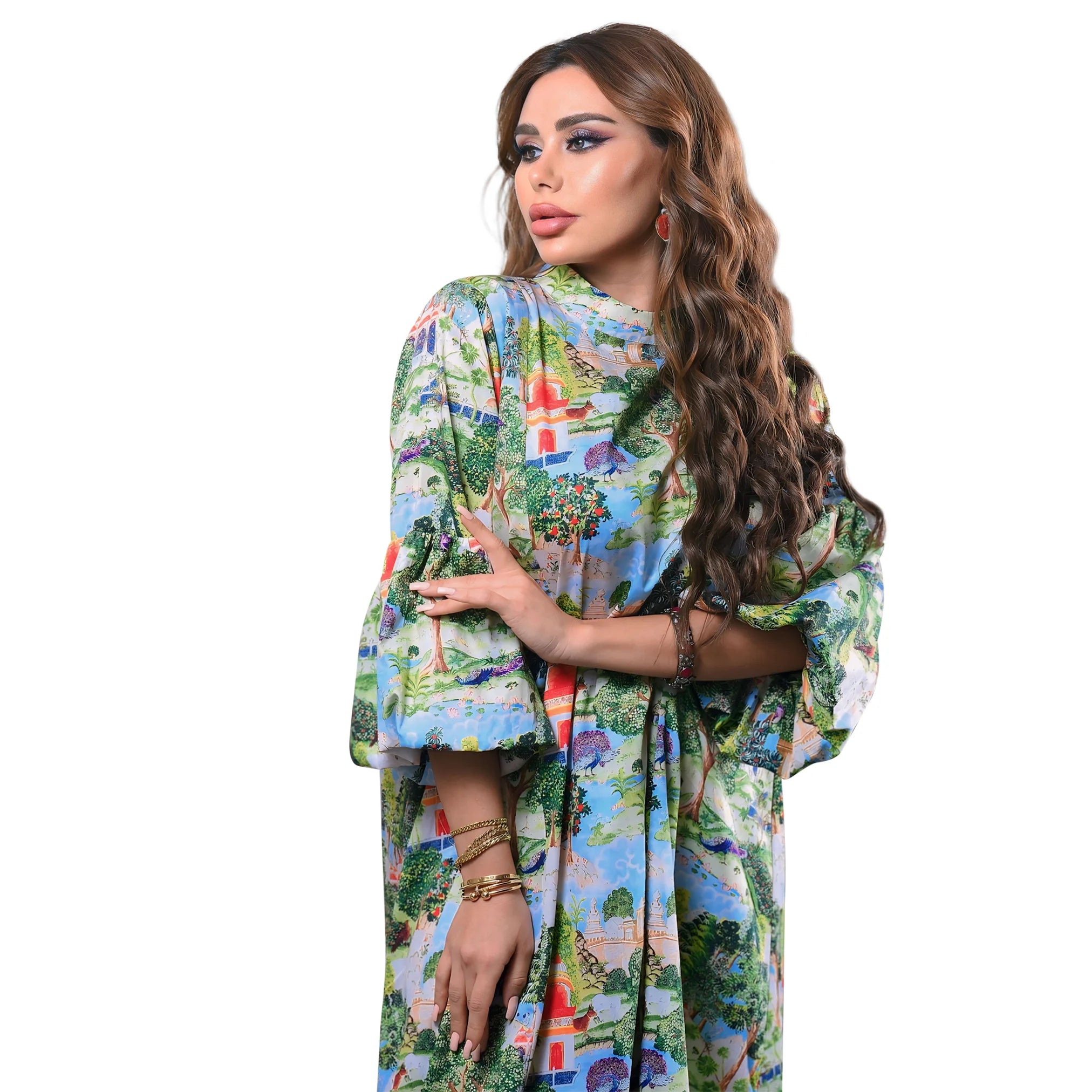 Woman wearing a colorful patterned jalabiya on a white background