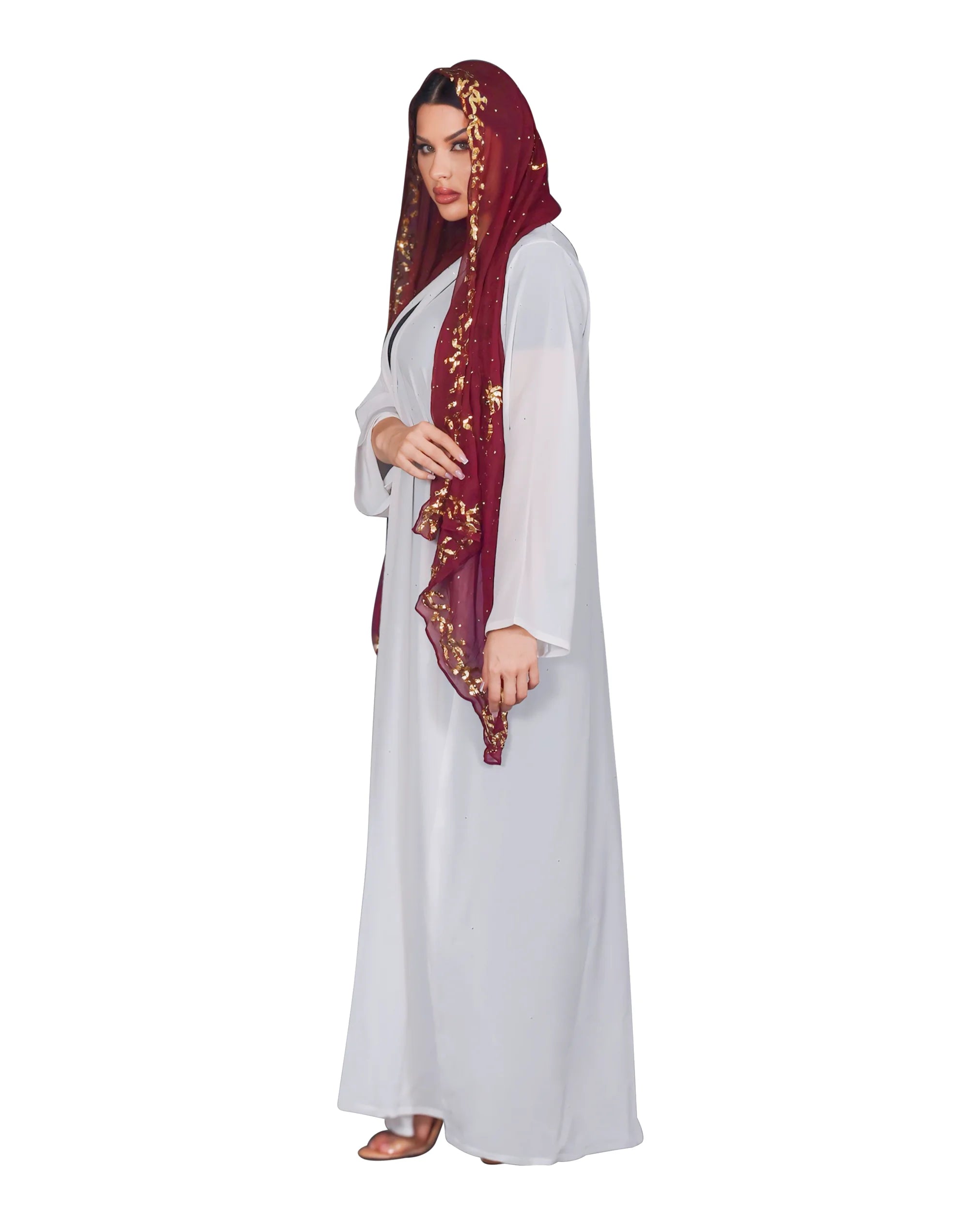 Woman wearing a white dress abaya and a maroon hijab with gold embroidery on a white background
