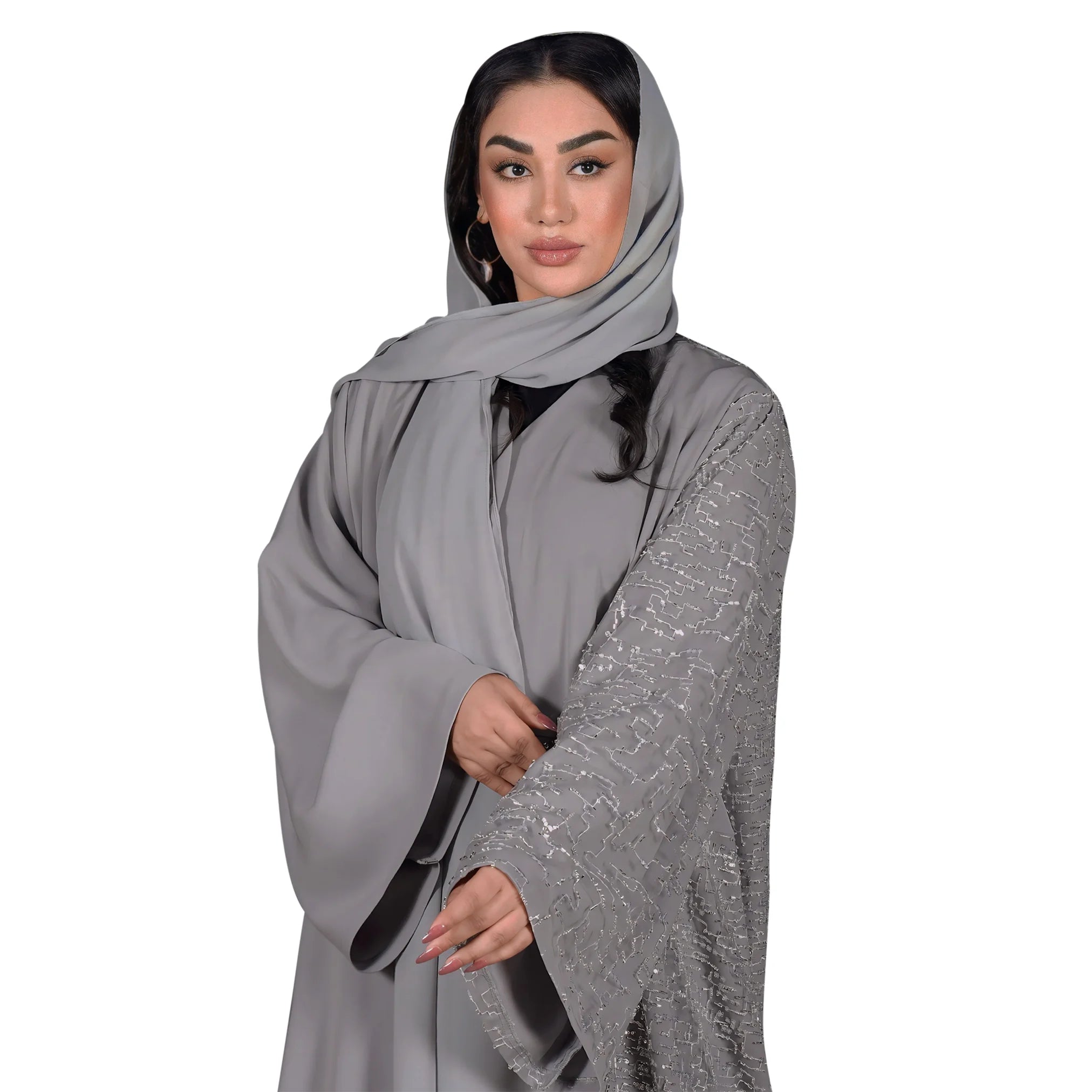 Woman wearing a gray hijab and abaya on a white background
