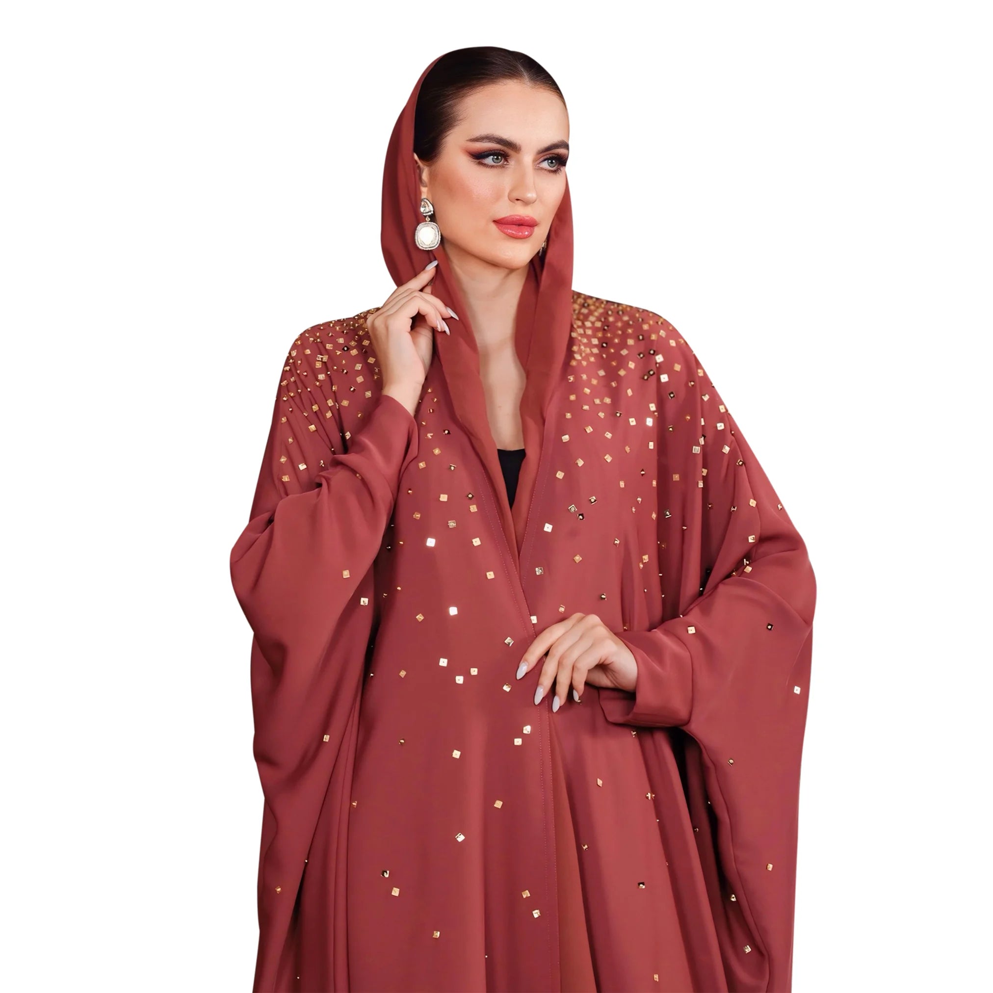 Woman wearing a red abaya with gold embellishments on a white background