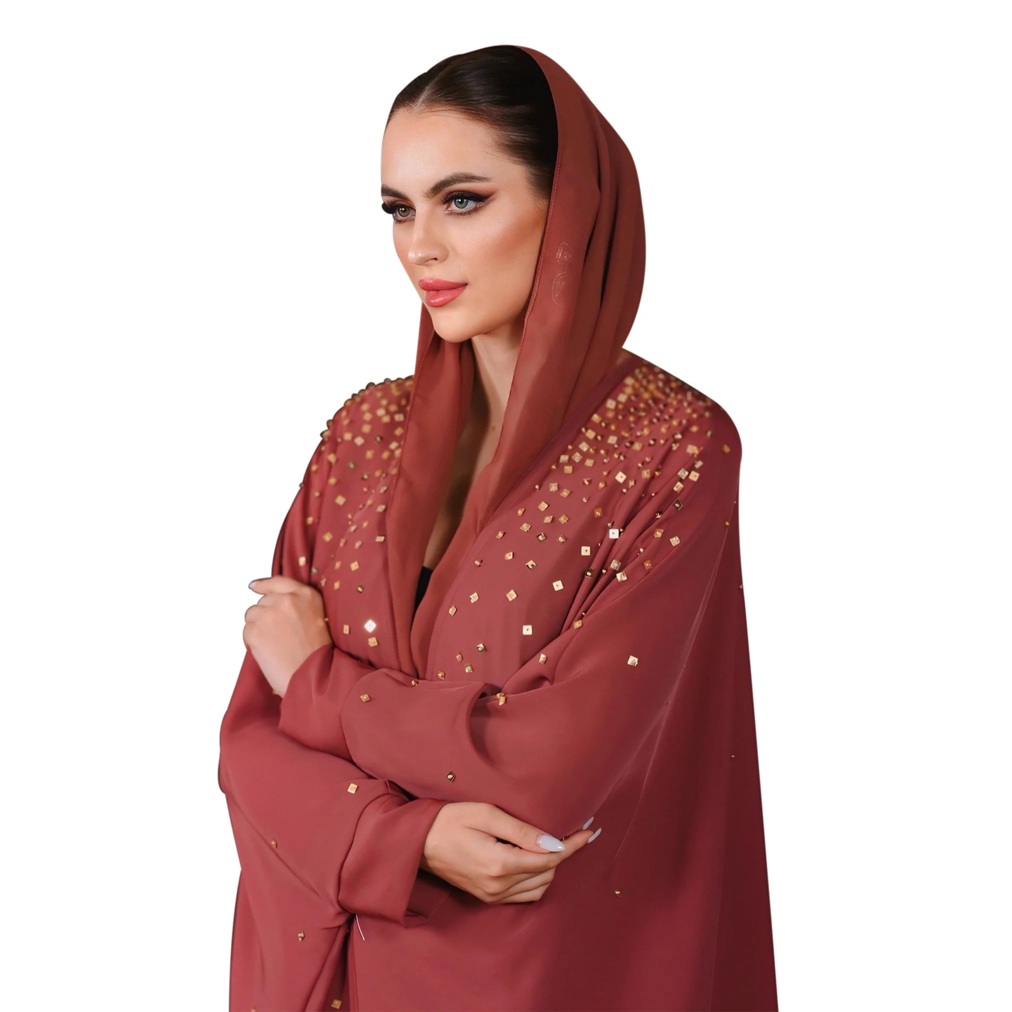 Woman wearing a red abaya with gold embellishments on a white background