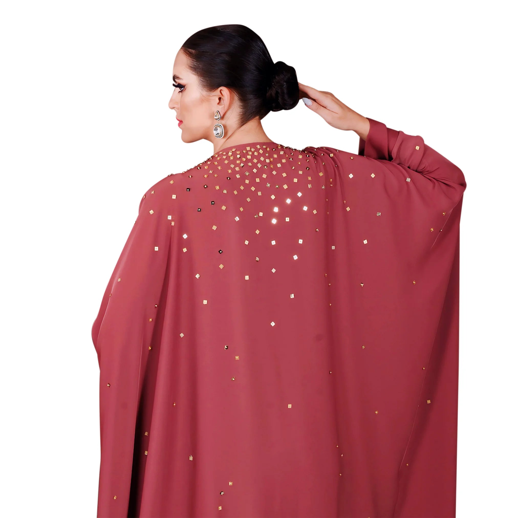 Maroon garment with gold embellishments on a white background