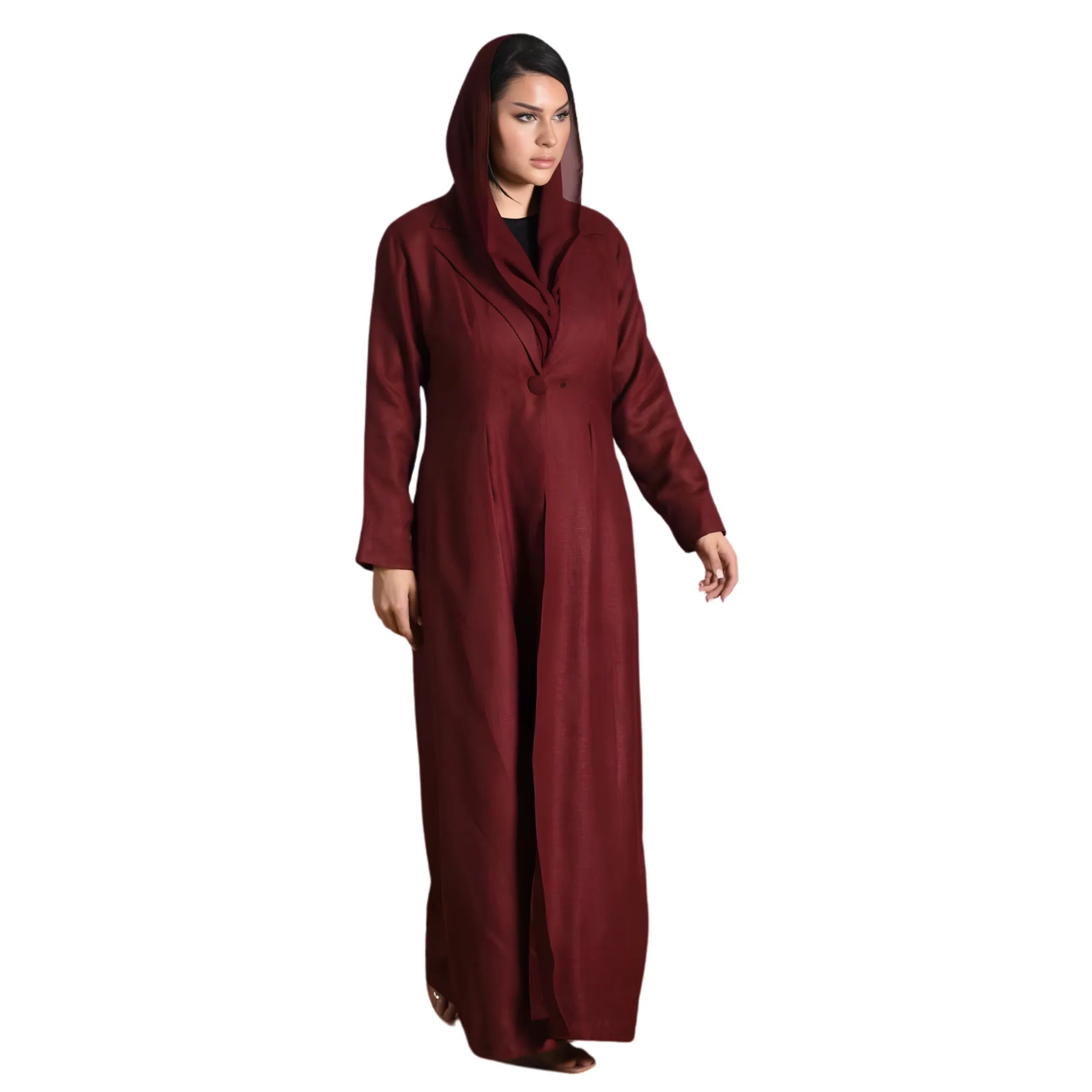 Woman wearing a long burgundy abaya on a white background