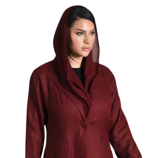 Woman wearing a burgundy abaya with a hood on a white background