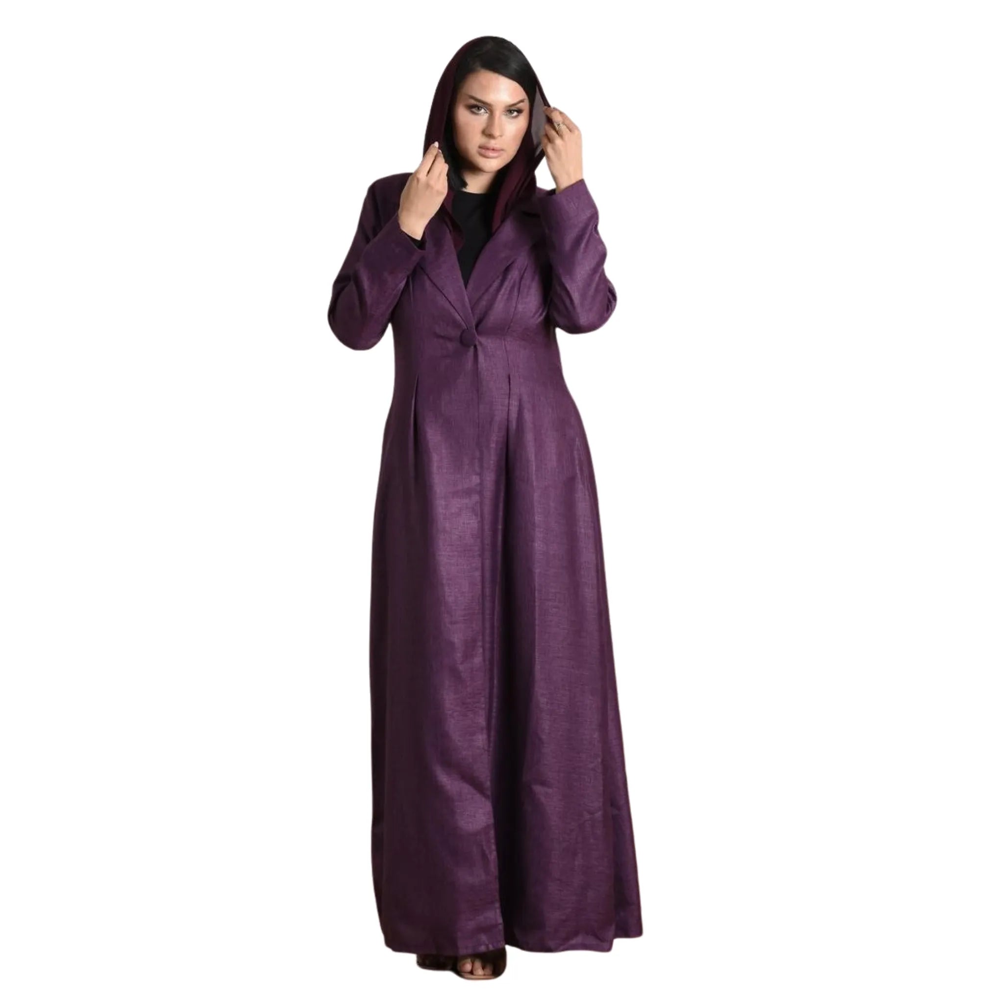 Woman wearing a long purple abaya against a white background