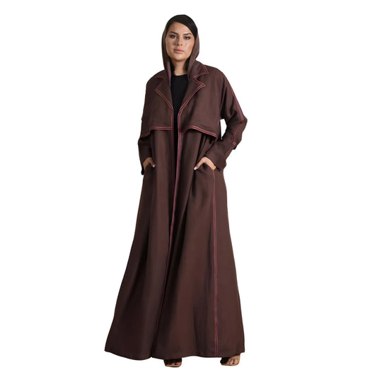 Woman wearing a long brown coat Abaya with a hood on a white background