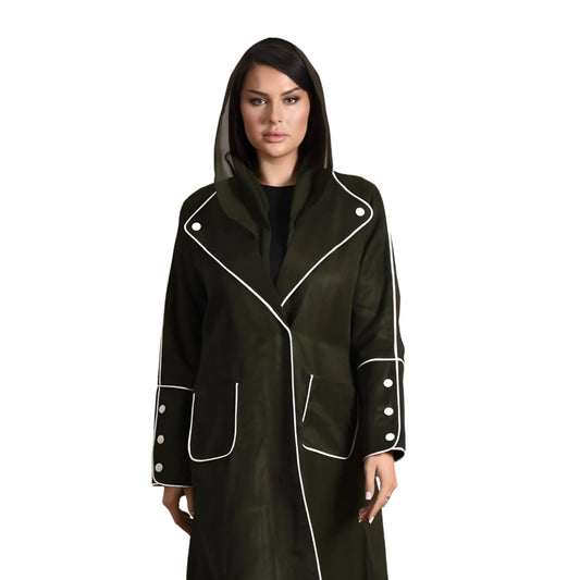 Woman wearing a black coat with white trim on a white background