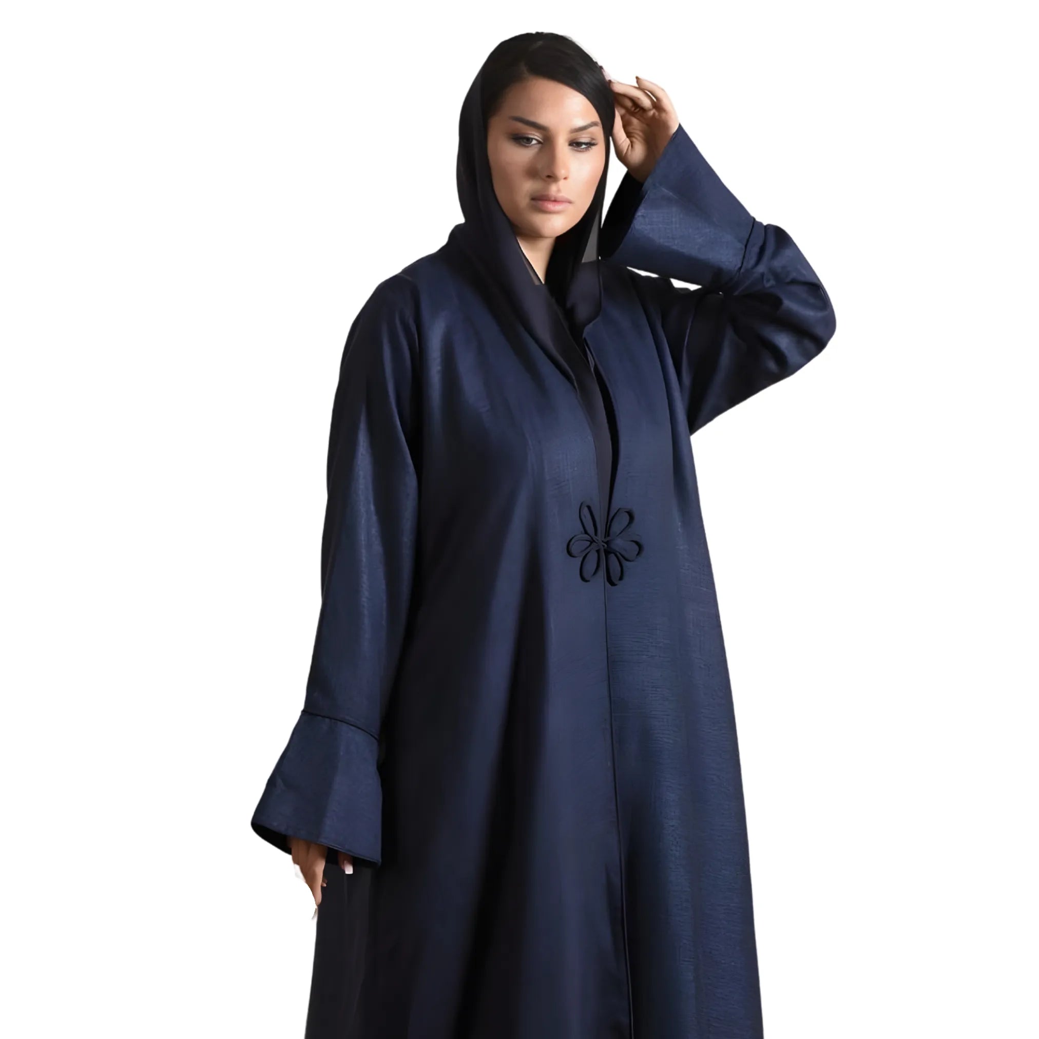 Woman wearing a navy blue abaya with floral embroidery on a white background
