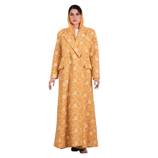 Woman wearing a yellow floral coat on a white background
