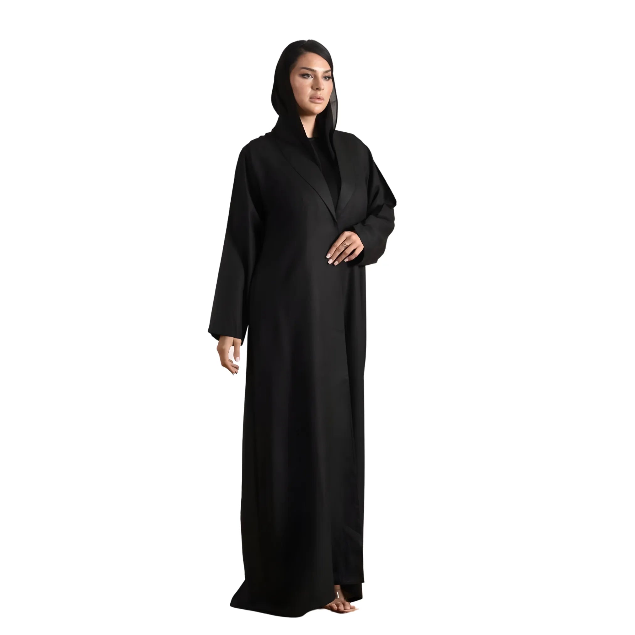 Woman wearing a black abaya on a white background