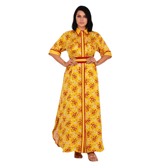 Woman wearing a yellow floral dress with a red belt on a white background