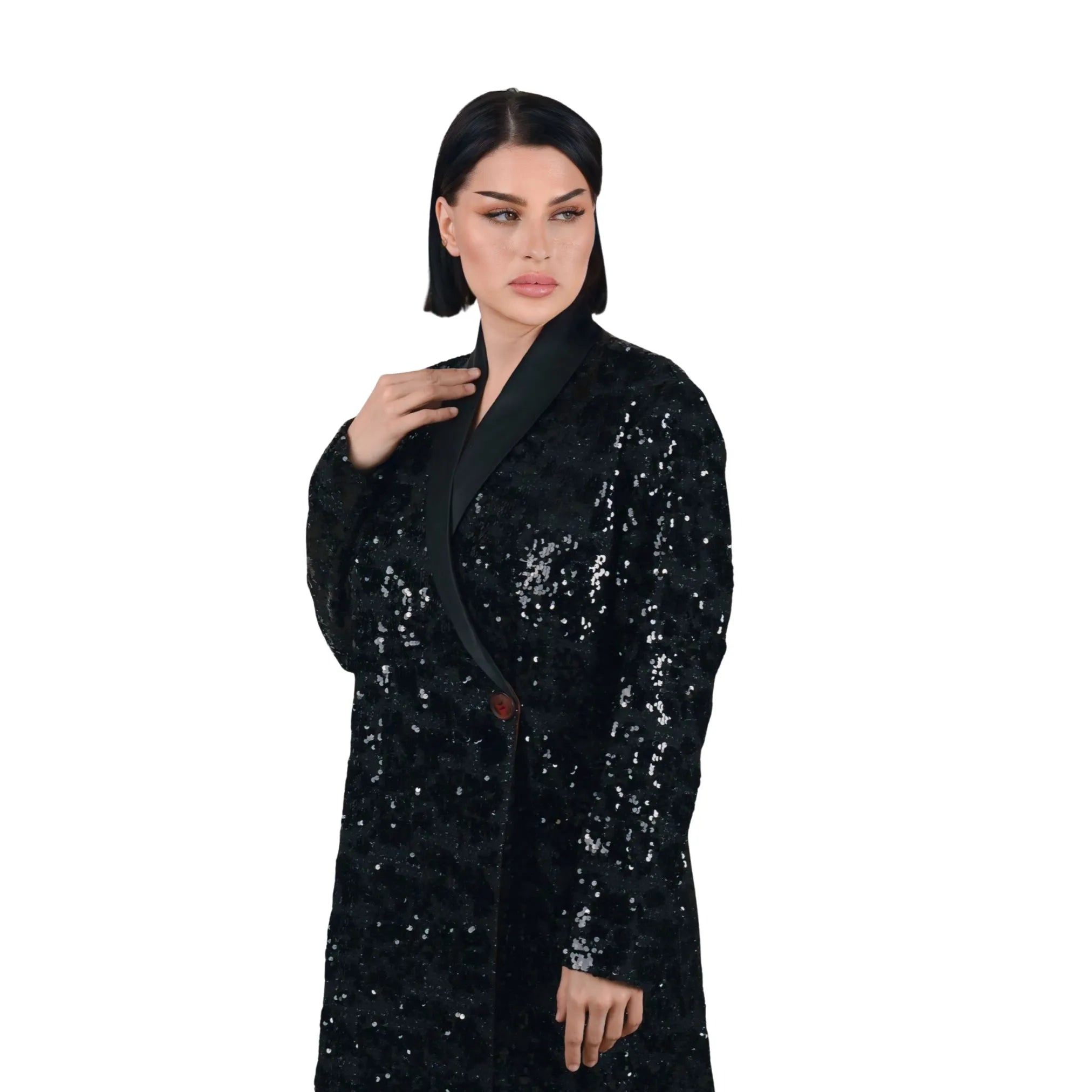 Woman wearing a black sequin coat on a white background