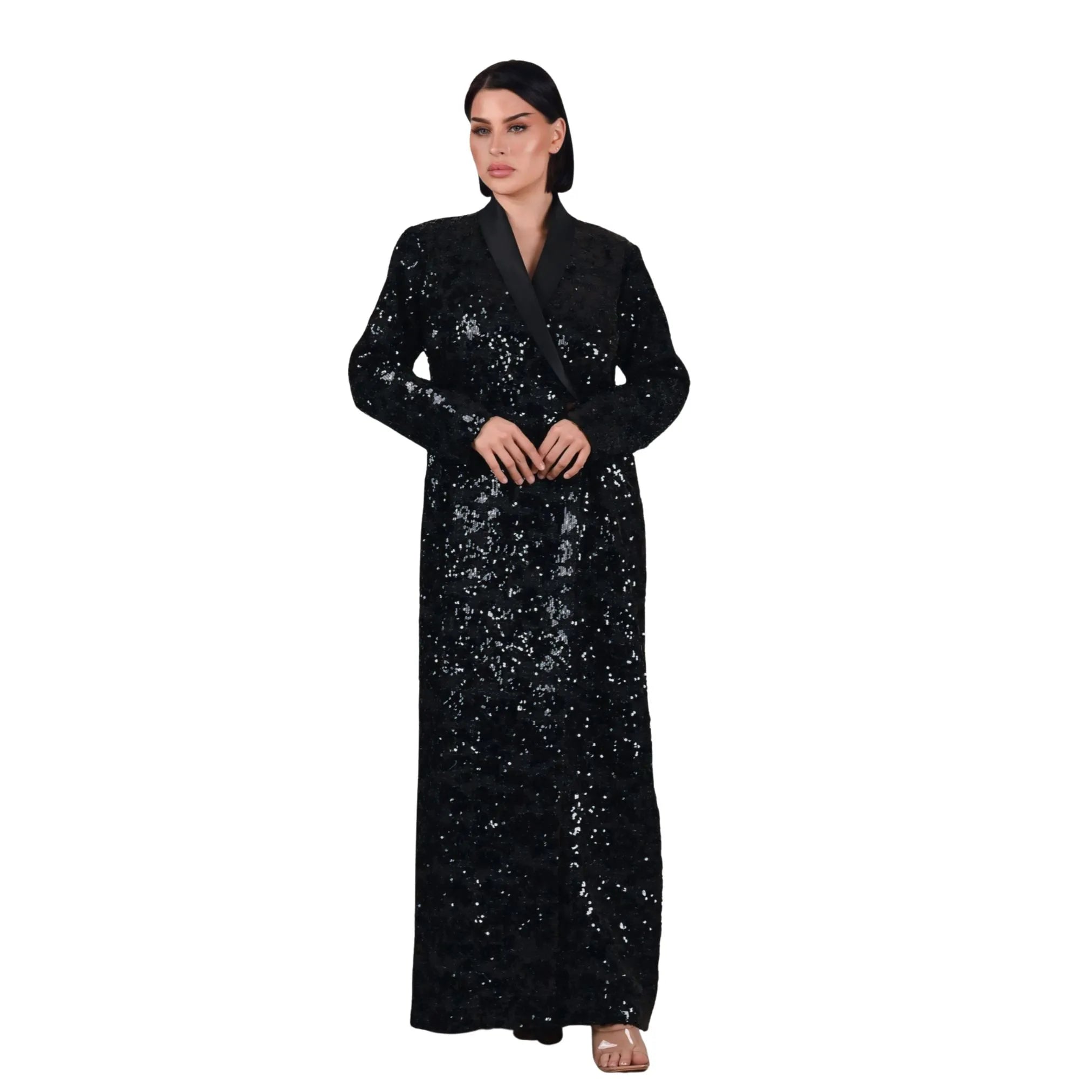 Woman wearing a black sequin dress on a white background