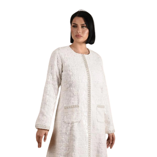 Woman wearing a white textured coat on a white background