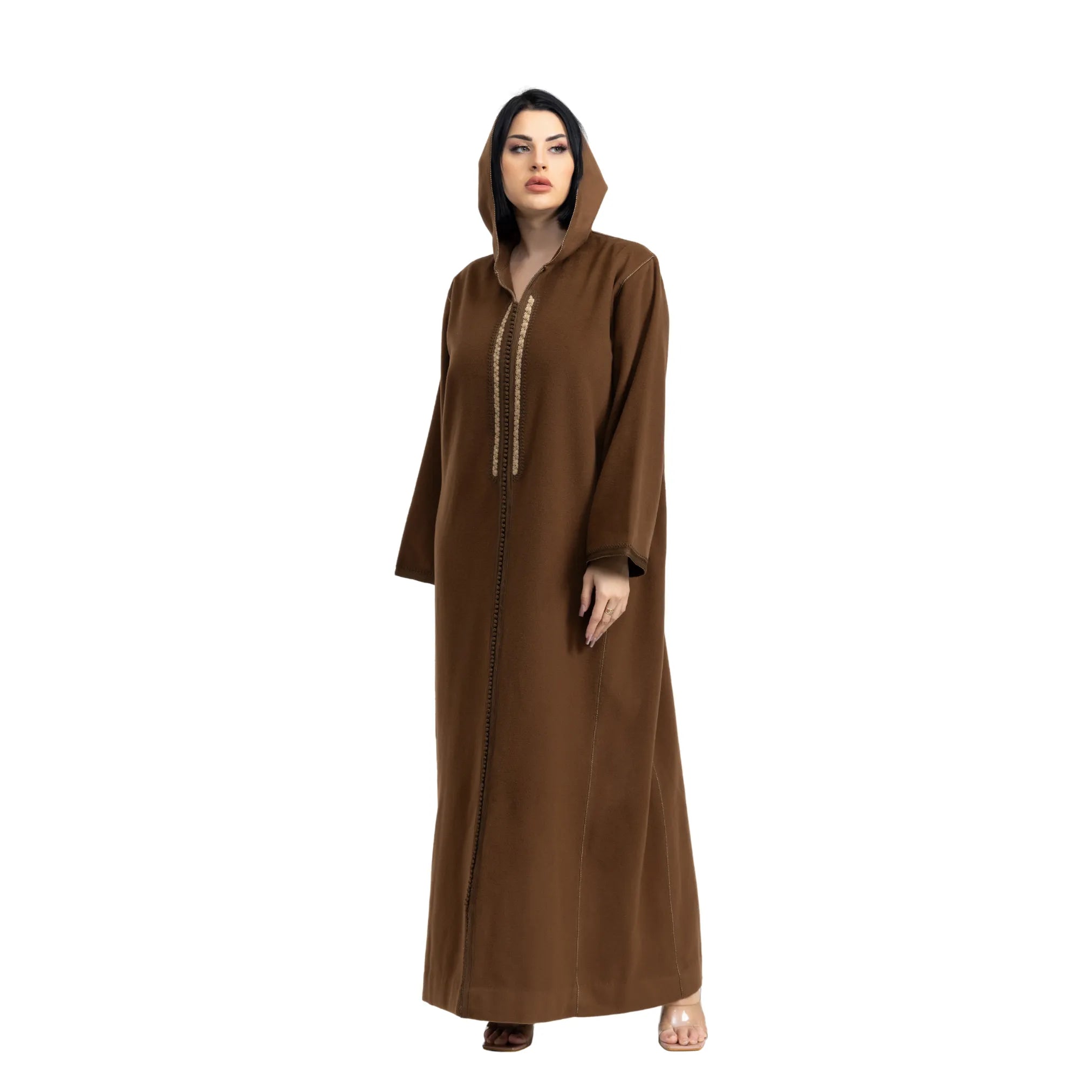Woman wearing a brown hooded jalabiya garment on a white background