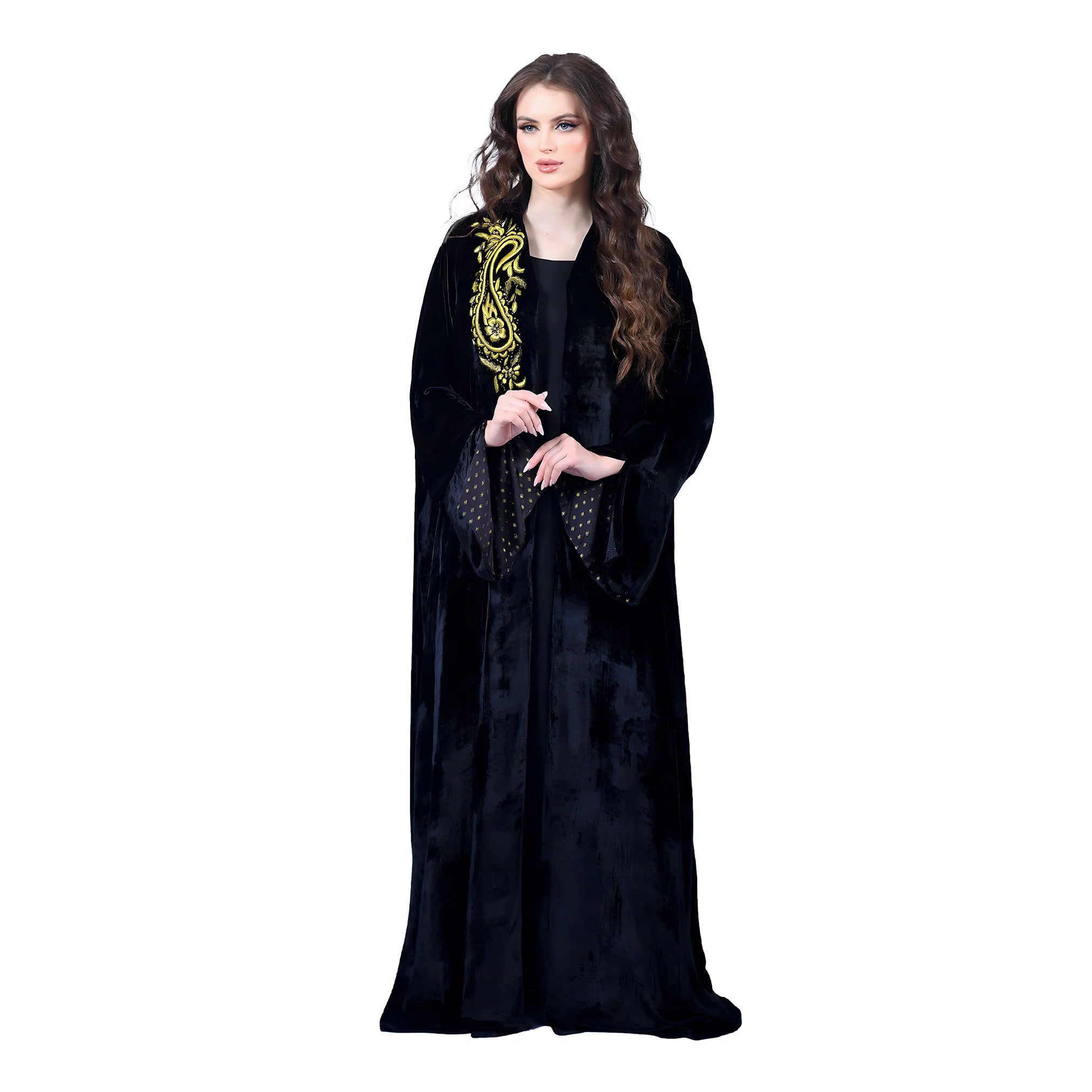 Woman wearing a black robe with gold embroidery on a white background