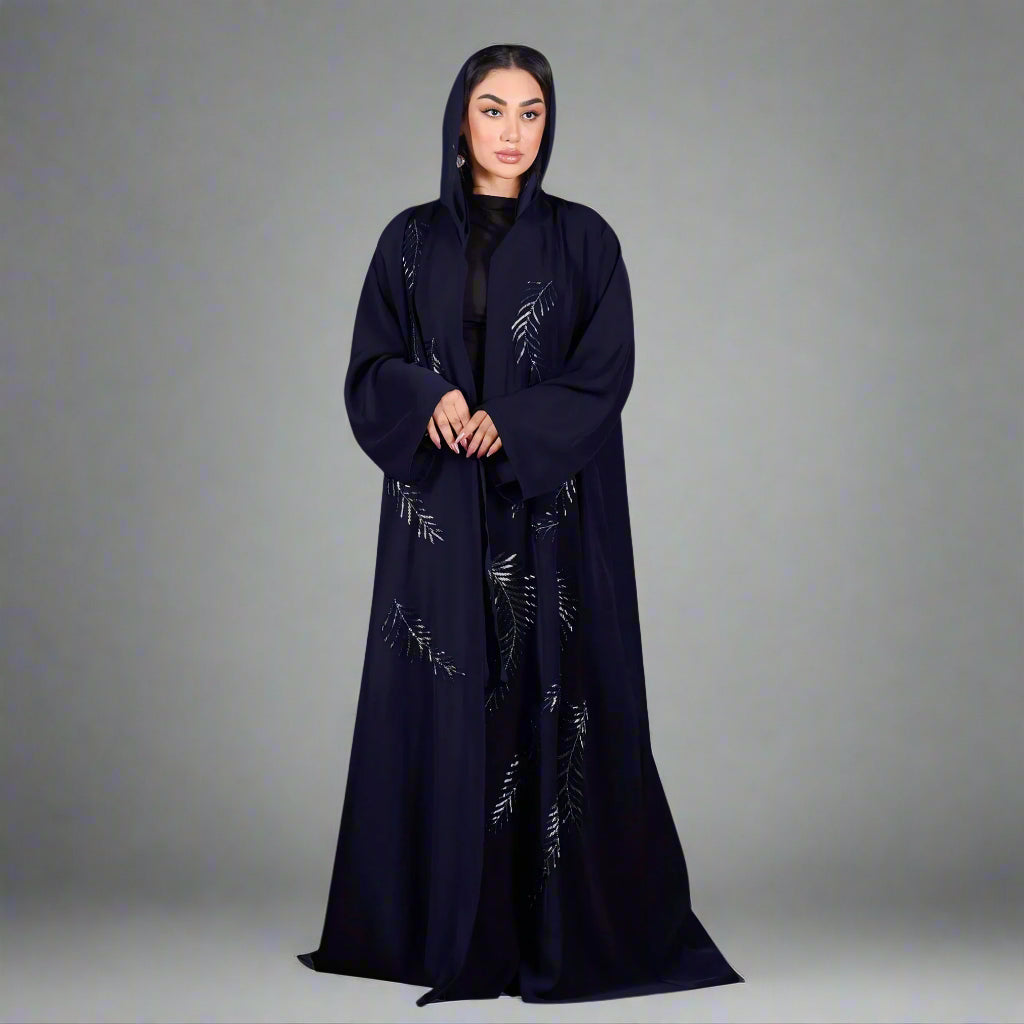 Navy blue abaya with intricate designs on a white background